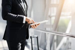 Unrecognizable entrepreneur with digital tablet in airport